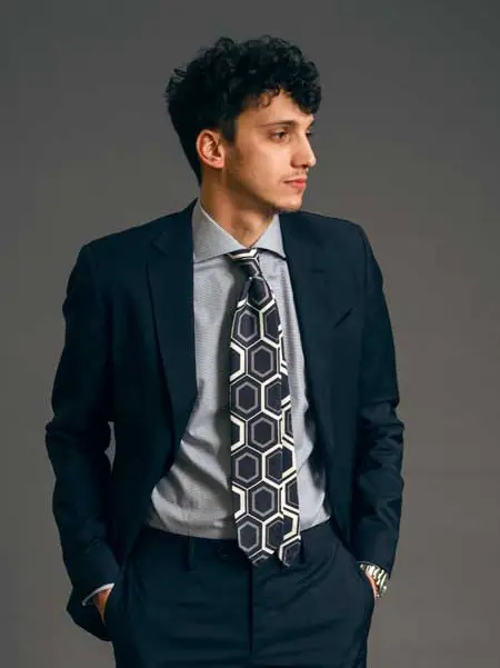 Printed silk tie in dark color is perfect to elevate your event's attire. Custom made in Como by Stefano Cau.