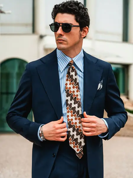 A printed silk tie in bright colour will elevate your formal attire. Custom Made in Como by Stefano Cau.